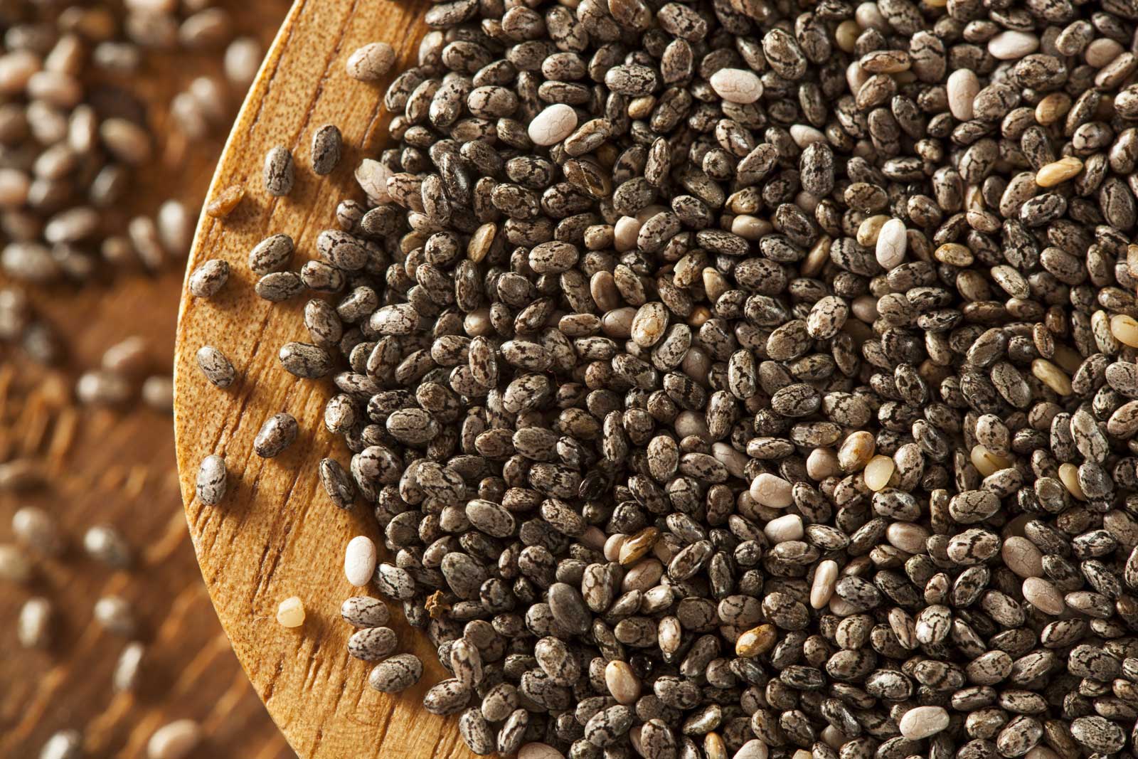 Organic Dry Black and White Chia Seeds against a background