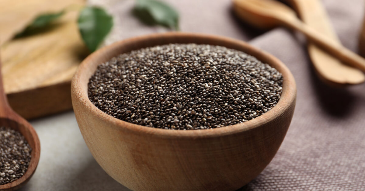 Chia seeds in bowl on table, closeup